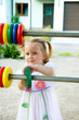 Little cheerful girl counting abacus Little cheerful girl counting abacus