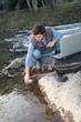 Man scientist testing quality of water in river
