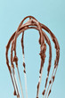 Metal whisk with chocolate