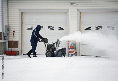 Photo: Man Operating A Snow Blower Man Operating A Snow Blower