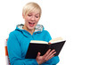 Happy girl reads a black book