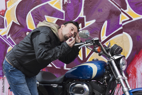 Photo: Motorcycle Man Making Up with Lipstick Motorcycle Man Making Up with Lipstick