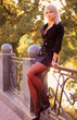 Beautiful blond girl posing in autumn scenery Beautiful blond girl posing in autumn scenery