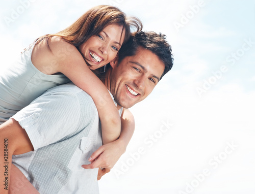 Photo: Happy young couple enjoying their vacation Happy young couple enjoying their vacation