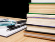 pile of book and pen on notebook on black pile of book and pen on notebook on black