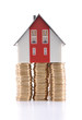 Mortgage concept. House at the top of coins. Mortgage concept. House at the top of coins.