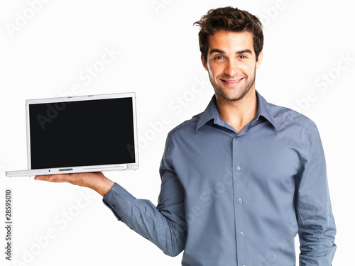 Photo: Man displaying a laptop Man displaying a laptop