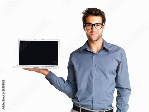 Photo: Man presenting with a laptop Man presenting with a laptop