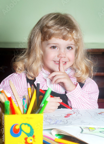 Photo: Cute little girl painting Cute little girl painting