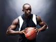 Young black guy in action with basketball