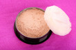 makeup powder on pink background