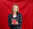 Pretty woman with candle in red