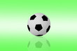 isolated football on green color background