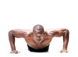 Muscular young man doing push ups exercise