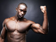 Sexy masculine model showing his muscular biceps