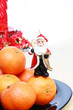 Pile of tangerines, Santa and christmas decoration