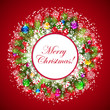 Christmas wreath with snow-covered branches of Christmas tree.