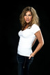 sexy blond girl in jeans and white T-shirt on standing
