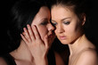 Tender kiss of two young lesbian girl friend on gray background Tender kiss of two young lesbian girl friend on gray background