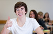 Happy Student has fun while working in classroom