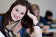 Happy Student has fun while working in classroom