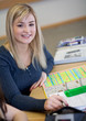 Happy Student has fun while working in classroom