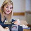 happy Student has fun while working in classroom