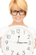 woman holding big clock woman holding big clock