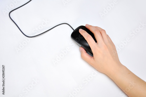 Photo: hand operating a mouse hand operating a mouse