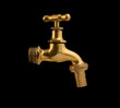 Metallic faucet isolated on black background