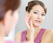 Woman caring of her  beautiful skin on the  face