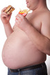 Fat man with sandwich and chips