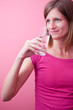 pretty, young woman drinking fresh water from a glass (color ton