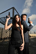 asian chinese couple carrying guns on rooftop 2