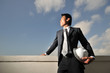 Asian Man holding a hard hat