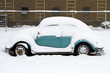 Snow coverd old timer car
