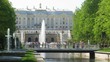 tourists in a beautiful garden of a Petergof with fountains