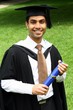 Photo: A portrait of a young Indian guy in a graduation gown. A portrait of a young Indian guy in a graduation gown.