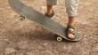 boy studies to go for a drive on a skateboard