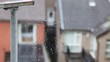 spiderweb on a very close shot, Irish houses on background