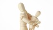 wooden figures of child embracing his parent by shoulders