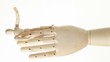 wooden figures of big hand holds man with raised hand wooden figures of big hand holds man with raised hand