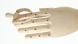 vertical video: rotating wooden figures man at big hand vertical video: rotating wooden figures man at big hand
