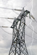 high-voltage pylon under cloudy sky