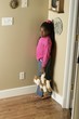 Girl Standing In The Corner
