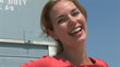 Video: Young woman leaning against lifeguard stand at beach Young woman leaning against lifeguard stand at beach