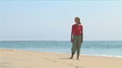 Video: Young woman at shoreline of ocean Young woman at shoreline of ocean