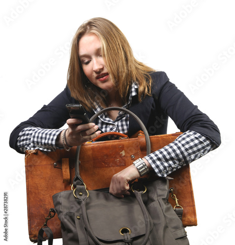 Photo: Young business woman with bag and suitcase Young business woman with bag and suitcase
