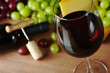 Red wine in wine glass with grapes and cheese Red wine in wine glass with grapes and cheese