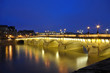 Reflections of lights and buildings on the river seine